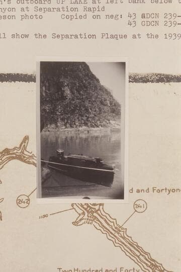 Harry Aleson's outboard "Up Lake" at left bank below the mouth the side canyon at Separation Rapid. A glass will show the Separation Plaque at the 1939 location